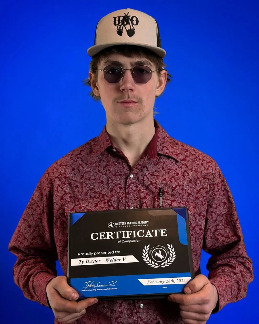 Western Welding Academy graduate holding a certificate