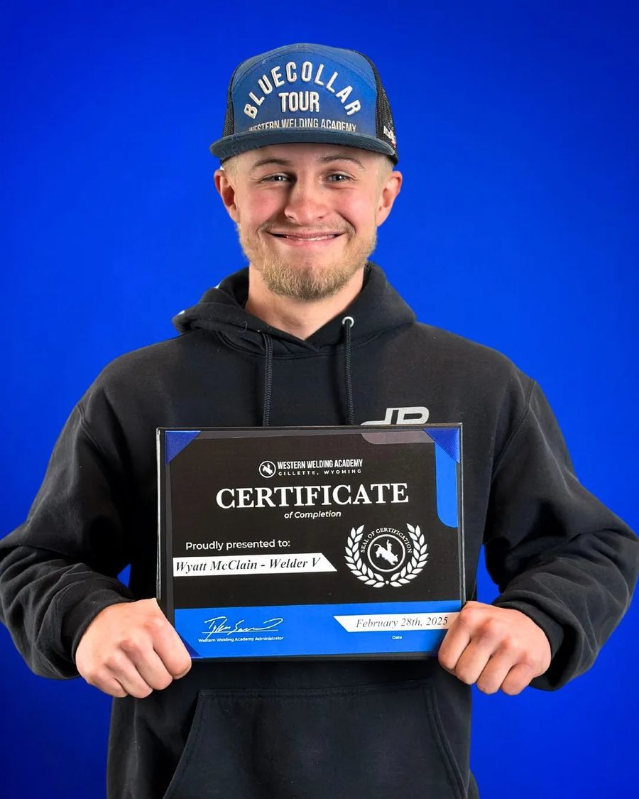 Western Welding Academy graduate holding a certificate