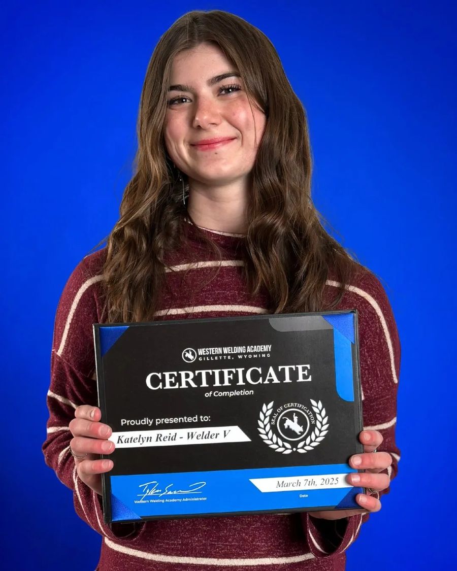 Western Welding Academy graduate holding a certificate