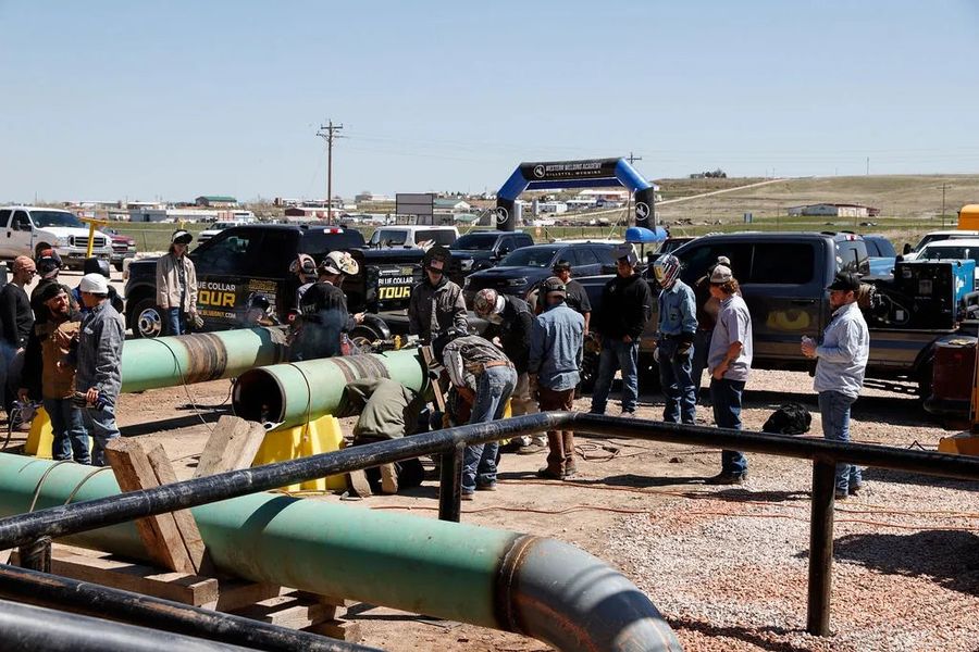 Students at the outdoor pipeline welding yard