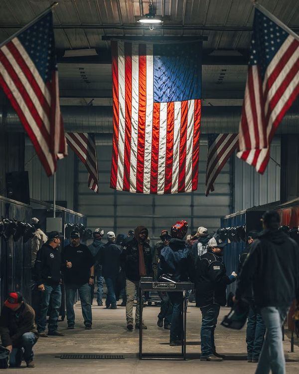 Crowd in the WWA shop under a giant American flag