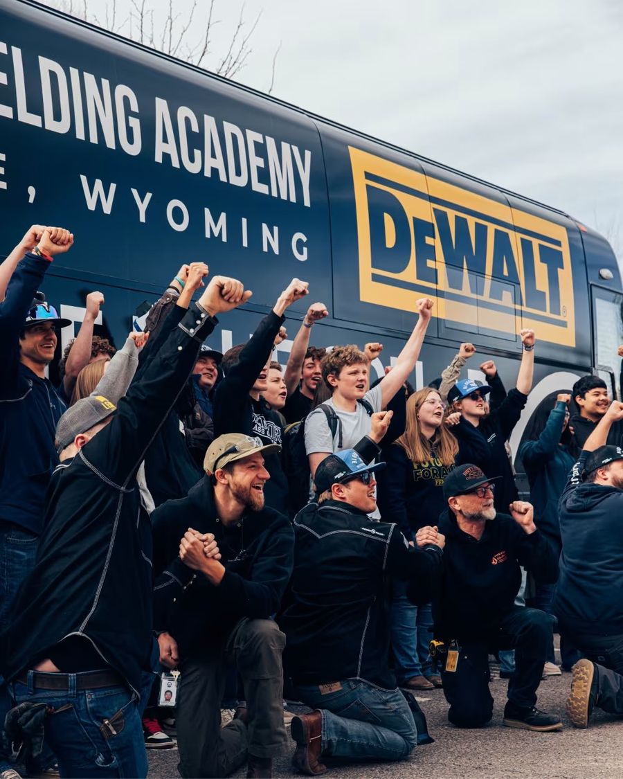 Students cheering at a Western Welding Academy event